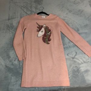 Pink sweater with unicorn sequin.